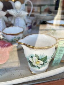 A photo of a teacup in a store window